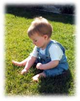 little boy in overalls